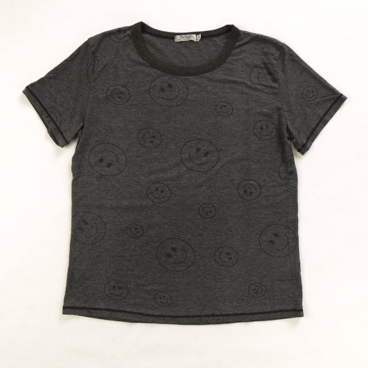 women's simple black t-shirt with larger and smaller happy faces spaced out and randomly distributed across the fabric