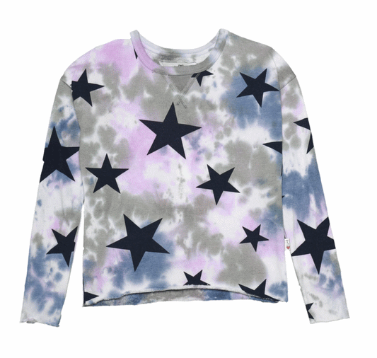 women's denim blue, pink, and gray tie-dye splotches on white fabric with different sized black stars printed throughout long-sleeved shirt with an upside-down triangular in-set fabric sewn underneath the neckline raw-edged hem at the ends of the sleeves and bottom hem