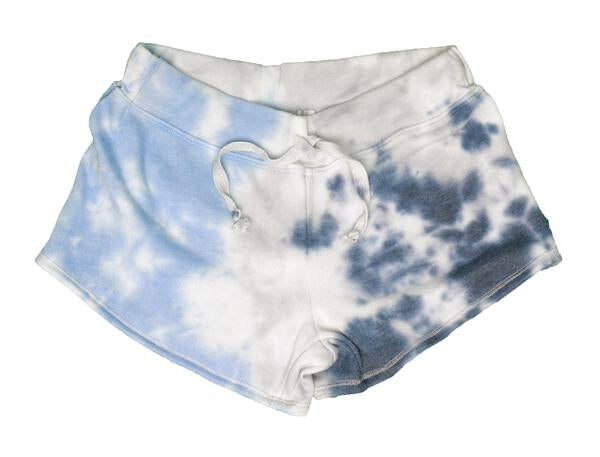 women's light-blue on left, gray down the middle, and navy blue on right tie-dye splotches on white fabric wide-legged shorts with raw hemming at pant leg ends, and thick waistband with the drawstring at the front tied together