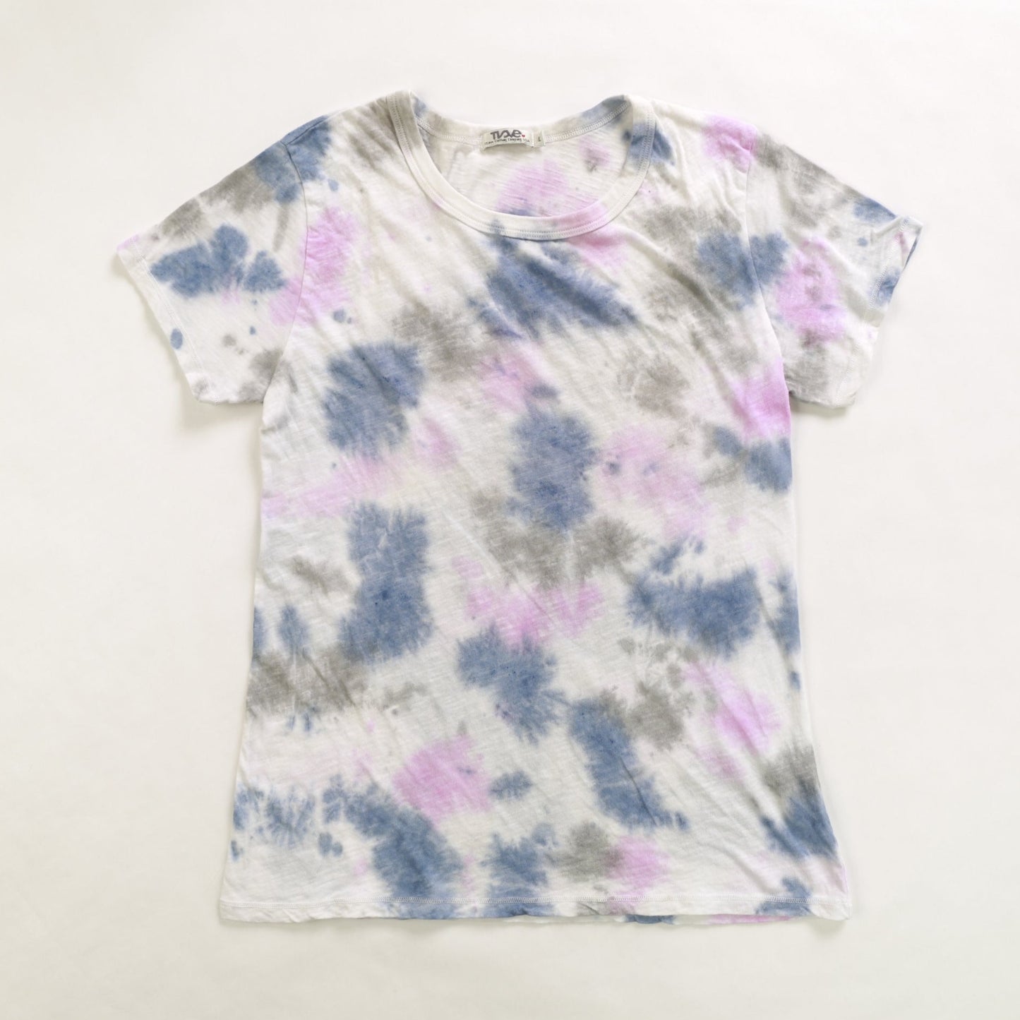 women's blue, pink, and gray tie-dye splotches on white loose-fitting short-sleeved shirt