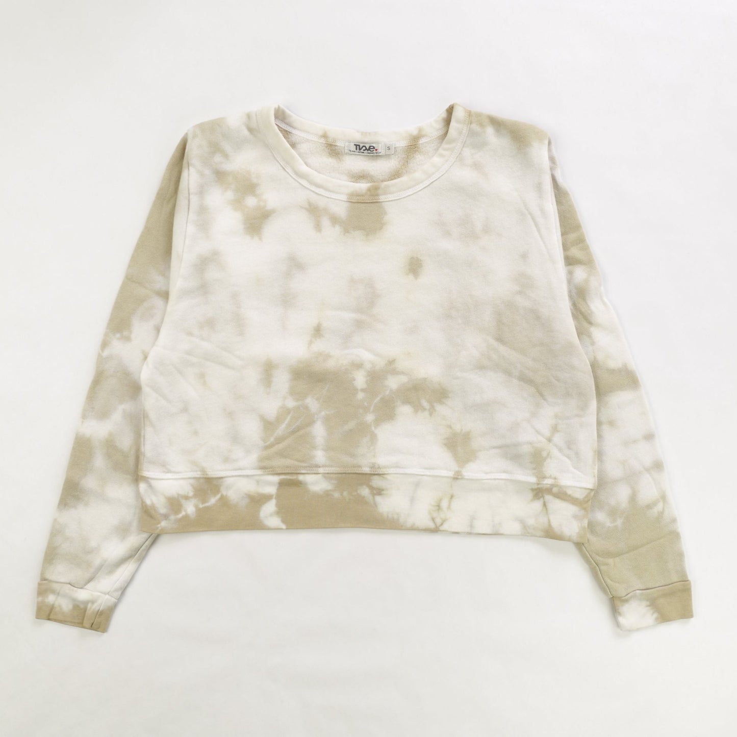 women's tan tie-dye splotches on white fabric shorter-length sweater