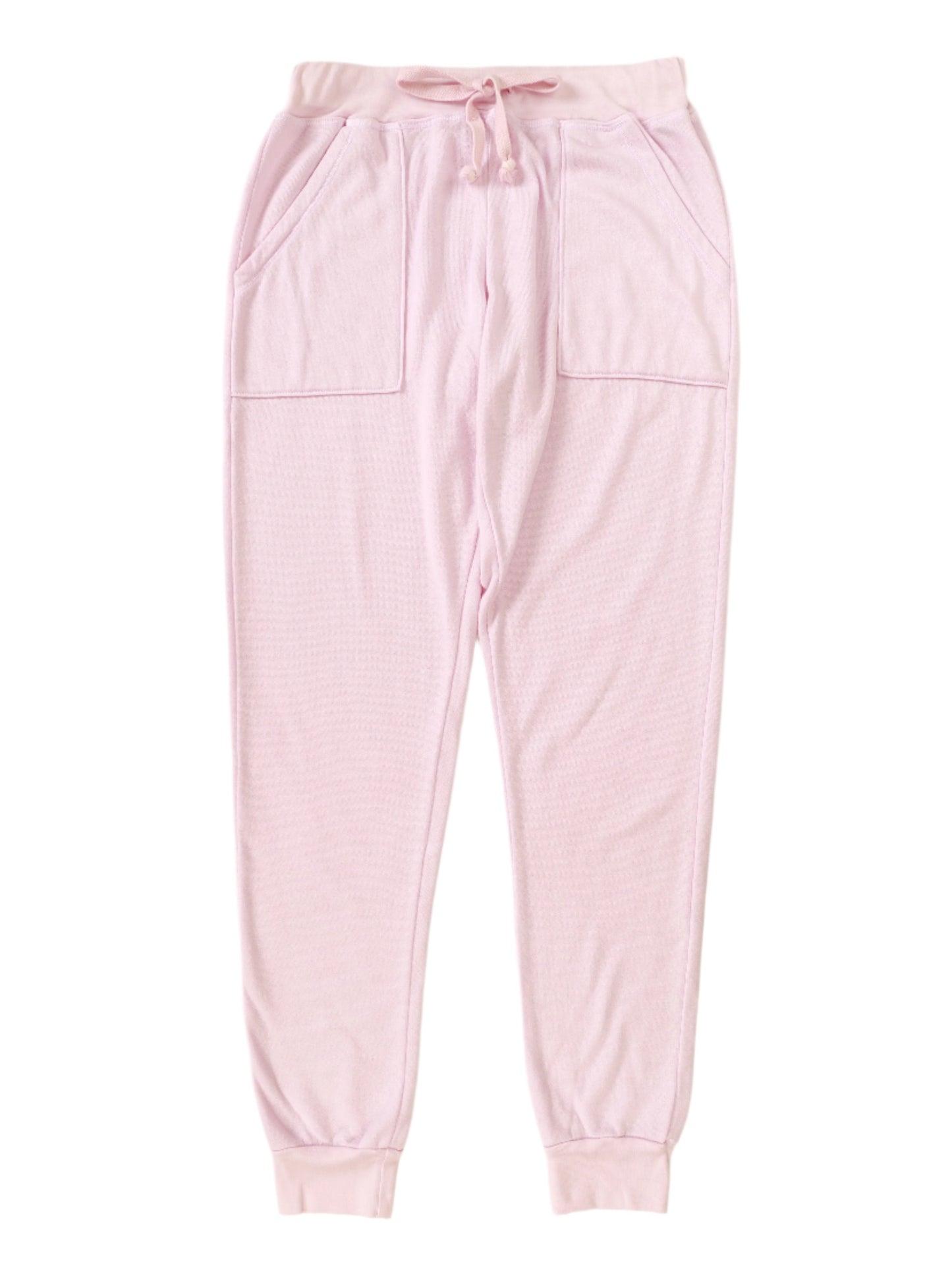 women's pink sweatpants with elasticized cuffs and waistband with drawstring tied in a bow and two front pockets sewn on front