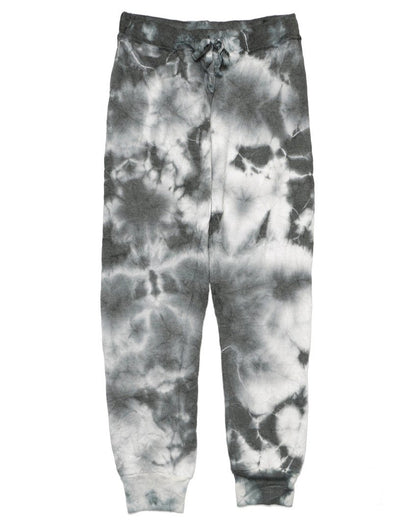 women's black tie-dye splotches on white fabric sweatpants with elastic cuffs at the ends of the pant legs and drawstring tied into a bow at the front of the waistband