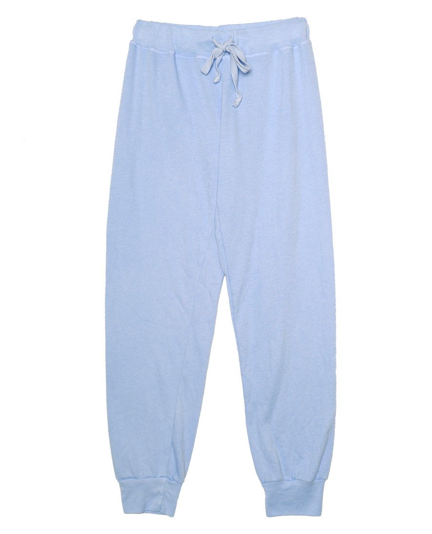 women's light blue sweatpants with elastic cuffs at the ends of the pant legs and drawstring tied into a bow at the front of the waistband