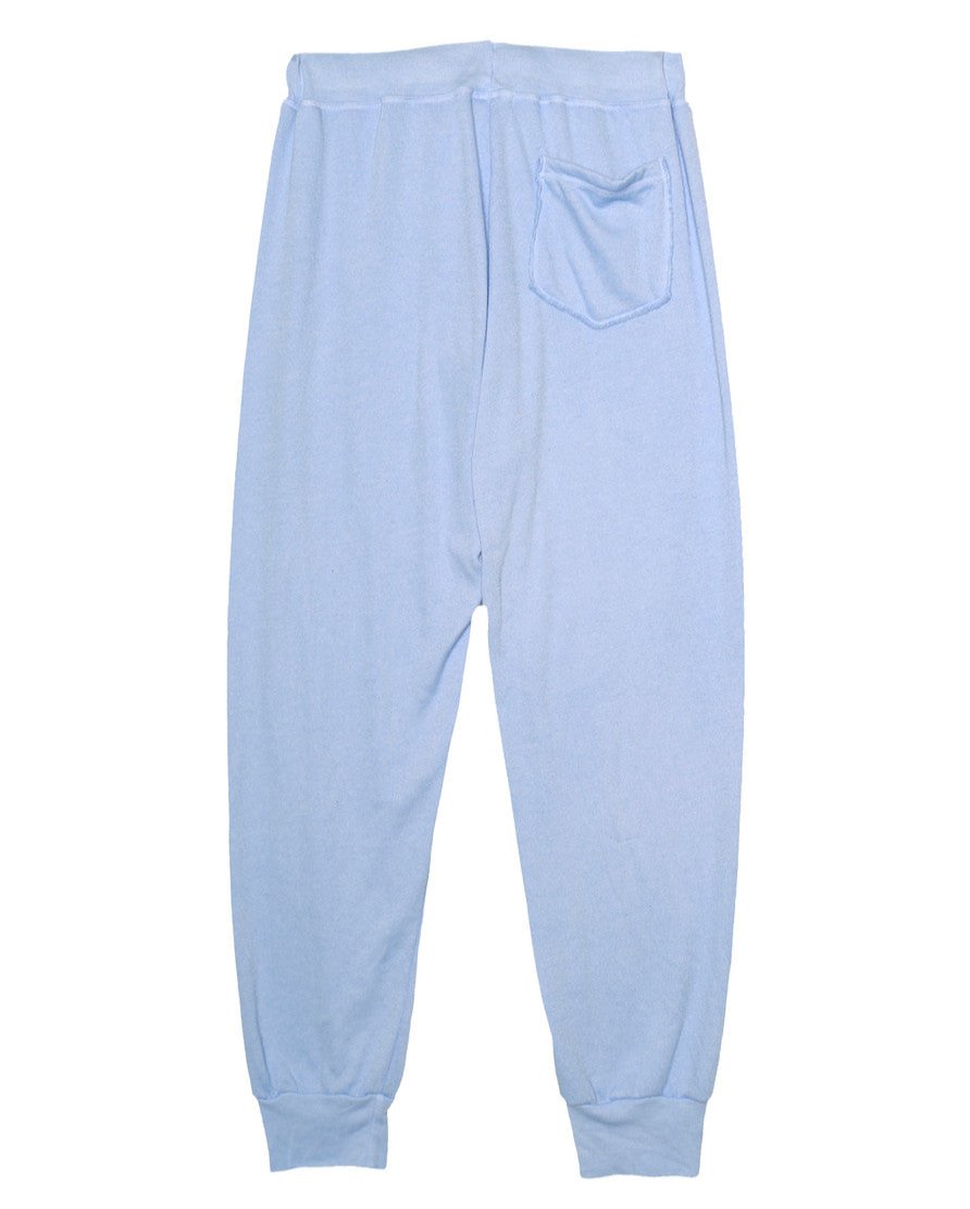 women's back side of light blue sweatpants with elastic cuffs at the ends of the pant legs and back pocket on the right 