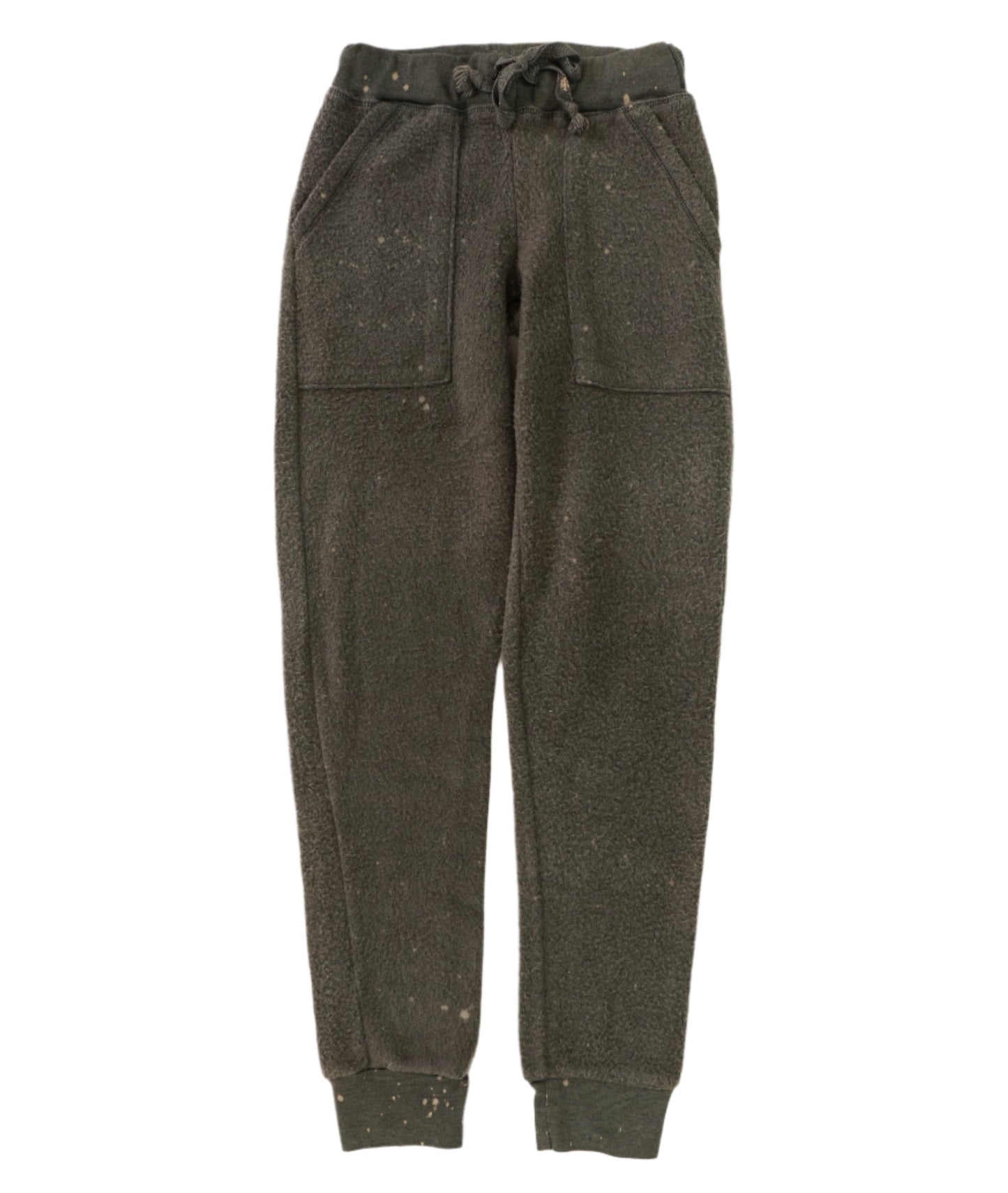 women's spotted tie-dye on black fuzzy sweatpants with elastic cuffs at the ends of the pant legs and drawstring tied into a bow at the front of the waistband