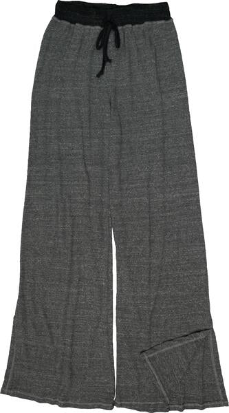 women's loose-fitting wide pant leg with few inches of vertical side slits down the outer sides of the pant leg horizontal-textured gray fabric pants with charcoal-black waistband and drawstring tied into a bow in the front